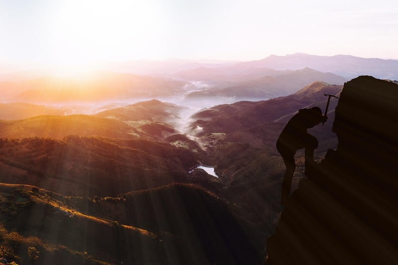 Climber Reaching Summit